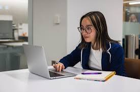 AI detection tools for teachers reviewing student essay on laptop